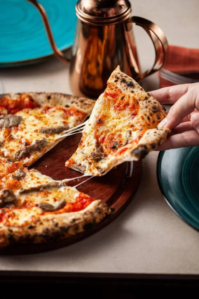 Na compra de uma pizza, ganhe 50% de desconto - Experiência válida para delivery