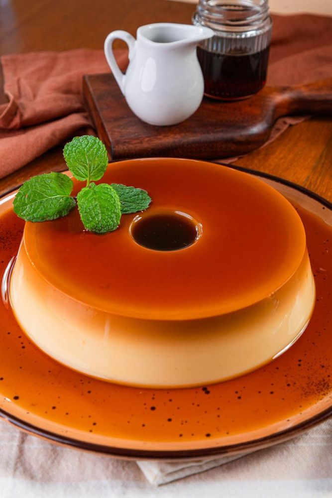 Na compra de um pudim tradicional de 1100 gramas, ganhe 50% de desconto