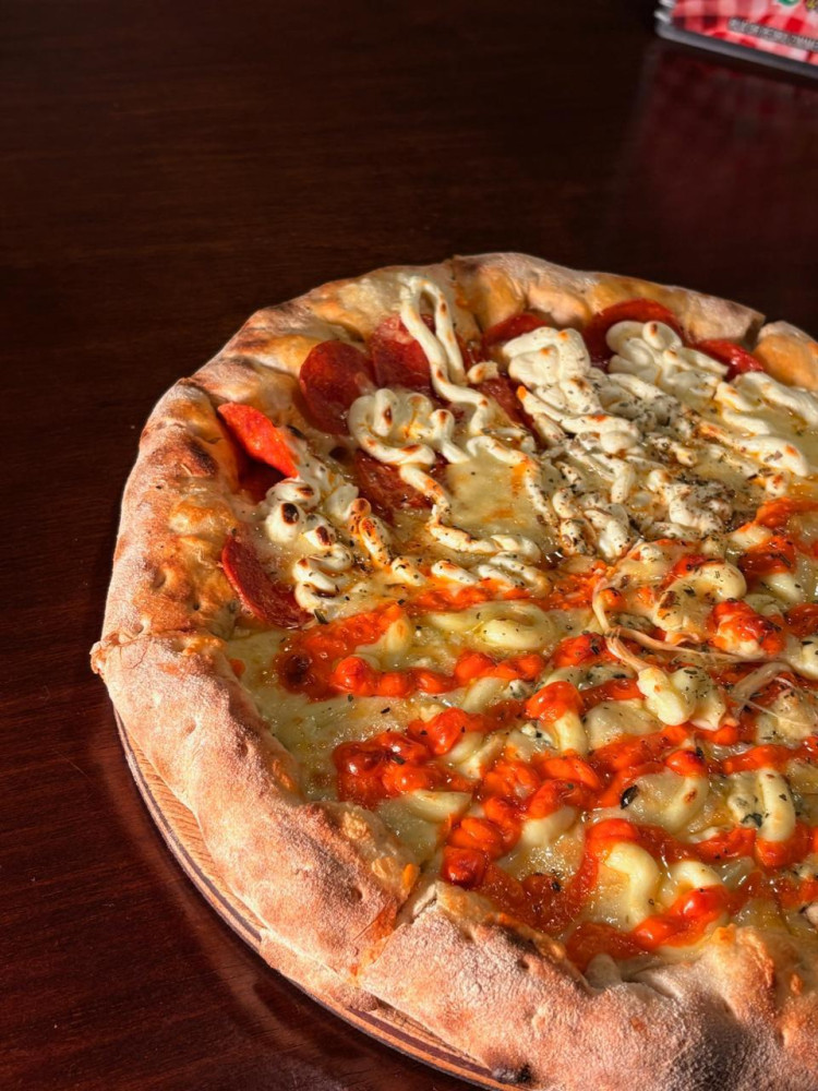 Na compra de uma pizza a la carte, ganhe 50% de desconto